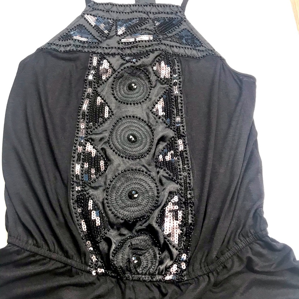 Black sleeveless peplum top